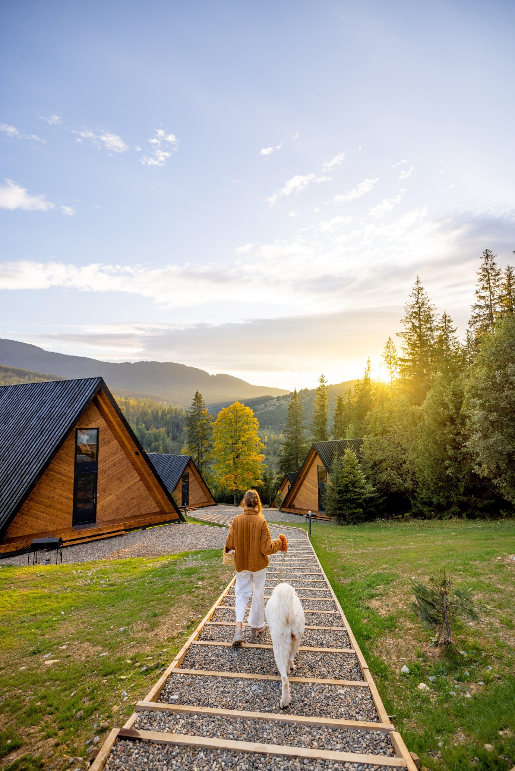 A-frame cabin with scenic mountain views at sunset.
